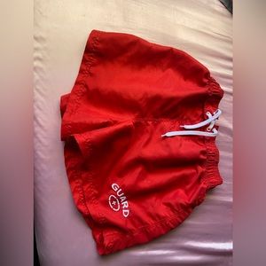 Large red lifeguard swim shorts